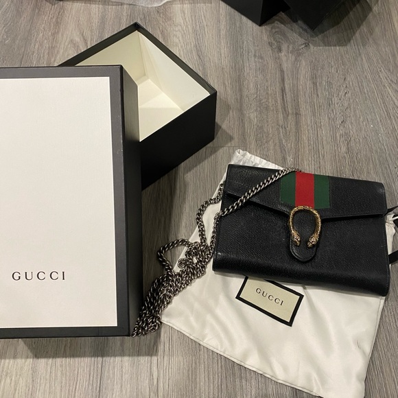 Gucci Handbags - Gently used Gucci side purse. Black leather.